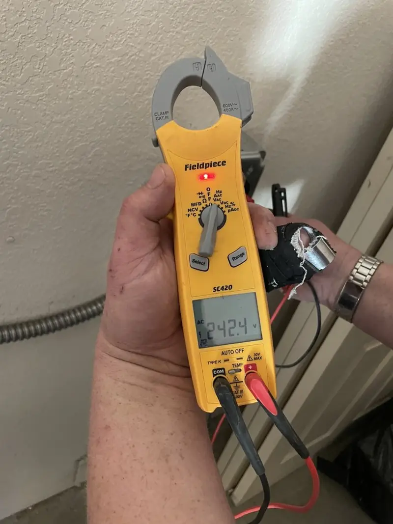 Voltage testing with clamp meter during Whole House Surge Protector in Dighton